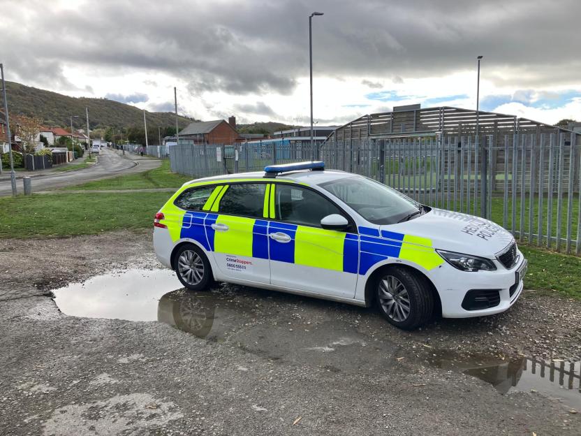 Police car at the scene where a body was found in the Dawson Drive area of Prestatyn.