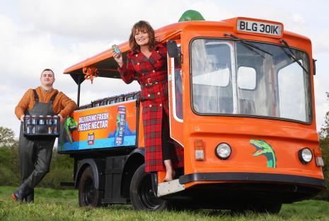 Lorraine Kelly with a Nessie Nectar delivery driver and an orange milk float.