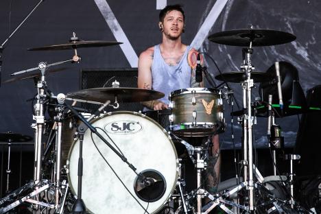 Daniel Williams of The Devil Wears Prada drumming at the Vans Warped Tour.