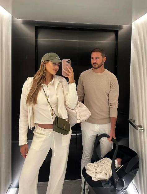 Arabella Chi and her partner with their newborn baby.