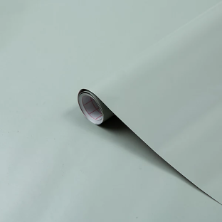 Roll of sage green self-adhesive vinyl film.