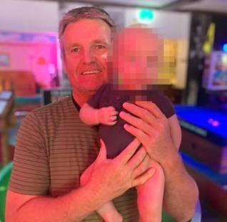Man holding a baby.