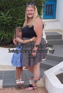 Woman and child standing together outdoors.