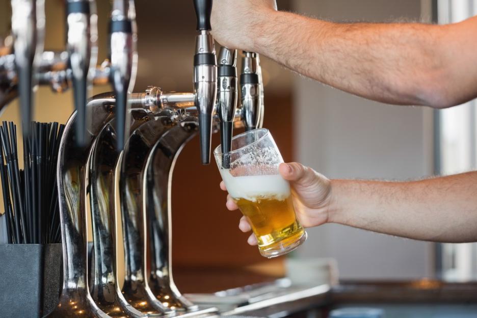 Bartender pouring beer.