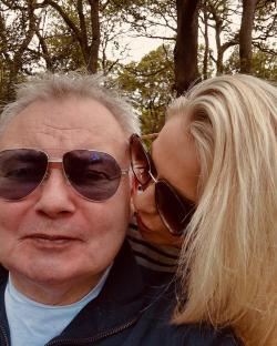 Eamonn Holmes and Katie Alexander embracing outdoors.