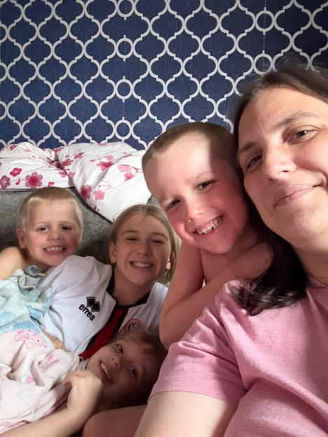 Leeanna with her four children, including Caiden who has congenital ichthyosis.