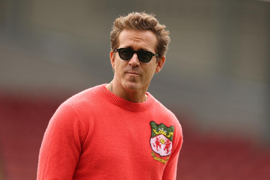 Ryan Reynolds, co-owner of Wrexham AFC, at a football match.