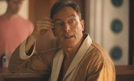 Screenshot of a man in a bathrobe from HBO's *The White Lotus*.