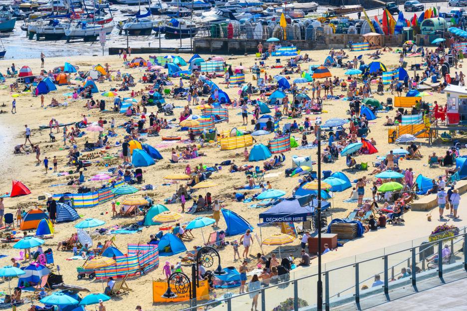 UK weather: Brits flock to beaches for balmy Bank Holiday sunshine today – with temps rising to 30C tomorrow