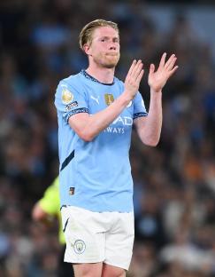 Kevin De Bruyne applauding fans at his last home match for Manchester City.
