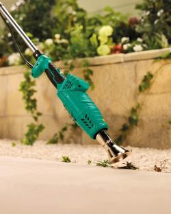 Electric weed killer in use.