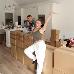 Molly Marsh and Zach Noble celebrating their move into a new home.