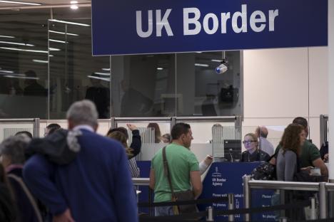 Passengers at UK Border control.