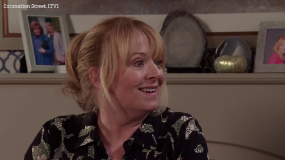 A Coronation Street actress smiling.