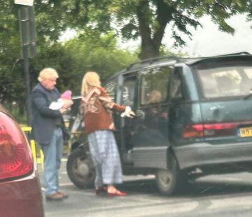 Blurry photo of Boris Johnson and Carrie Johnson with their baby.