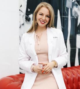A dentist in a white coat.