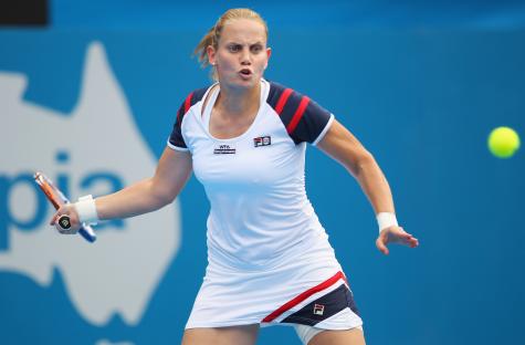 Jelena Dokic playing a forehand in a tennis match.
