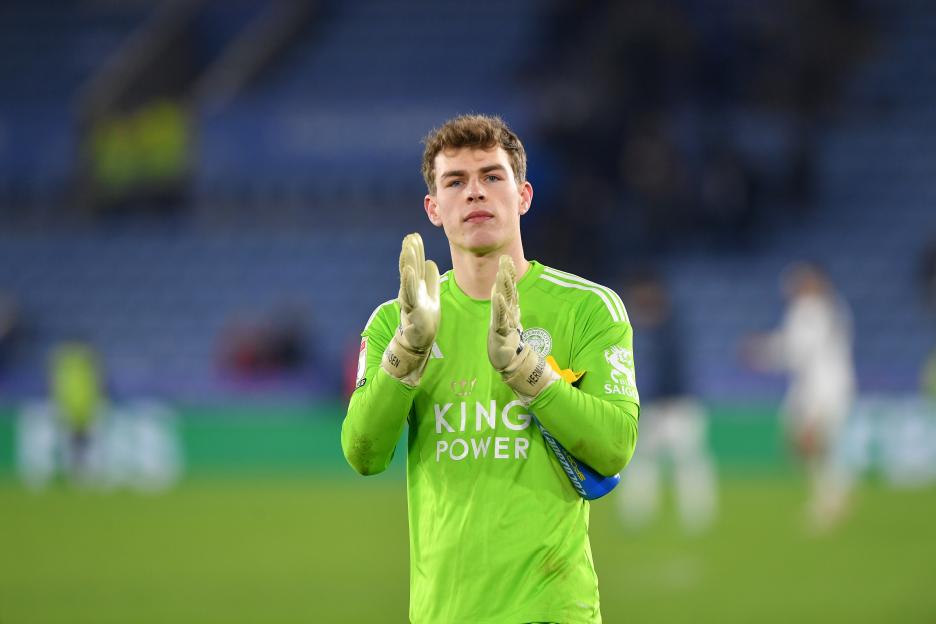 Mads Hermansen of Leicester City applauding at a soccer match.