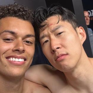 Two men in a Tottenham dressing room.