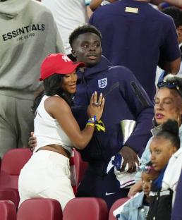 Bukayo Saka with Tolami Benson after a soccer match.