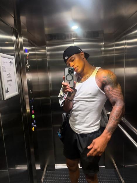 Man taking a selfie in an elevator.