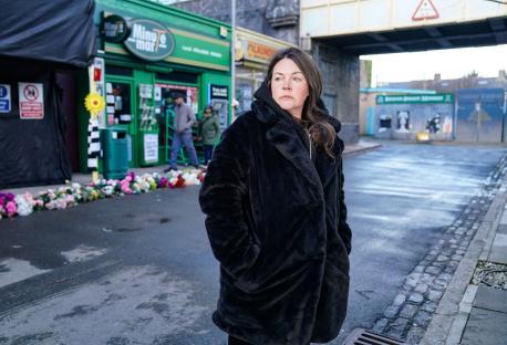 Stacey Slater from EastEnders on a street.