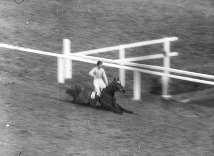 Black and white photo of Dick Francis riding Devon Loch, The Queen Mother's horse, which fell during the Grand National.