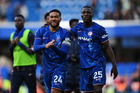 Reece James and Moises Caicedo of Chelsea applaud fans.