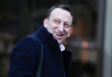 Photo of Tony Bloom smiling.