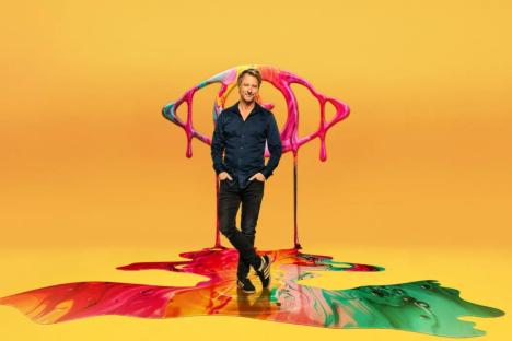 An image collage containing 1 images, Image 1 shows Chesney Hawkes standing on colorful paint, in front of a paint eye