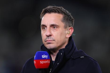 Gary Neville speaking into a Sky Sports microphone.