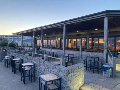 Exterior view of South Beach Cafe at Haven Devon Cliffs Holiday Park.