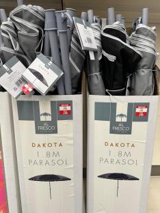 Boxes of Al Fresco Living Dakota 1.8m parasols on sale for £10.