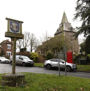 Wethersfield village sign, church, and cars.