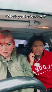 Screenshot of a couple in a car, the text