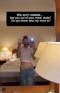 Woman taking a selfie in a hotel room, text overlay reads: