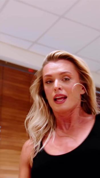 Nadiya Bychkova in a black top with her mouth slightly open.