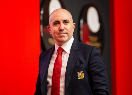 Omar Berrada, CEO of Manchester United, in a suit.