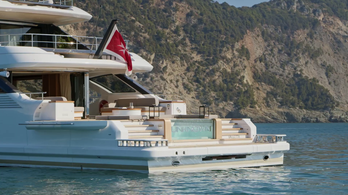 Man sitting on a Benetti yacht.