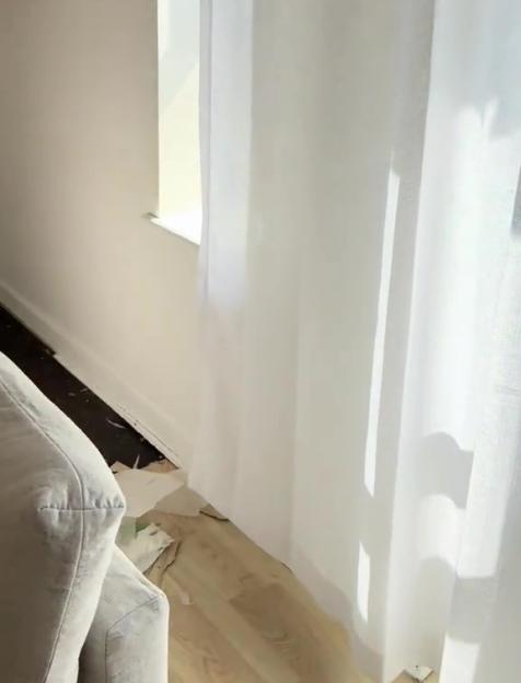 Woman discovering hidden treasure under flooring.