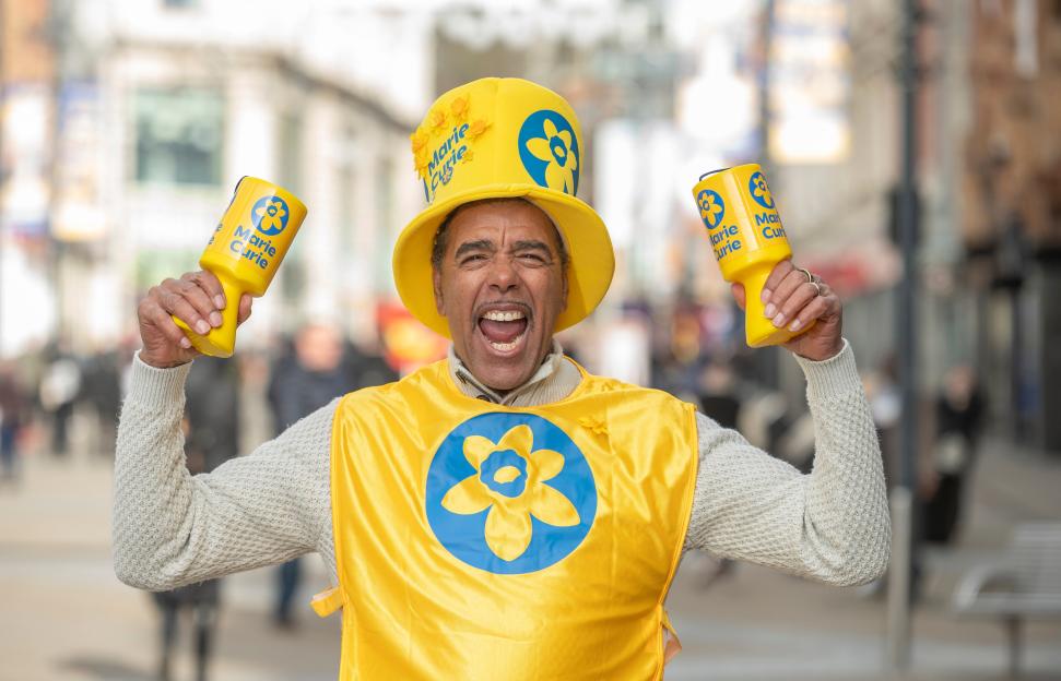 Football broadcaster and Marie Curie ambassador Chris Kamara joins volunteers in Leeds, to help launch the Charity's Great Daffodil Appeal 2025.