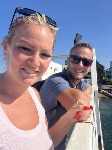 Couple smiling on a boat.