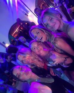 Group selfie of women at a party.