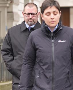 Two police officers leaving Westminster Magistrates' Court.