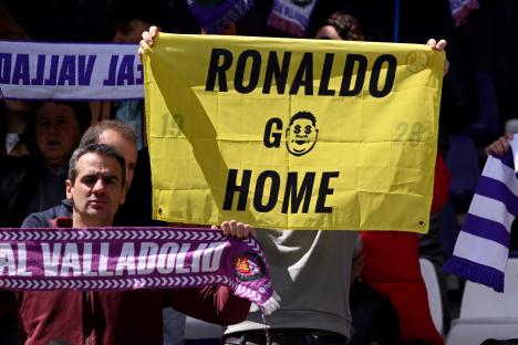 A Real Valladolid CF fan holds a sign that says