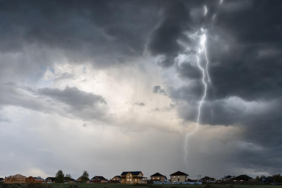 Cloud storm sky with thunderbolt over the village in rural scene