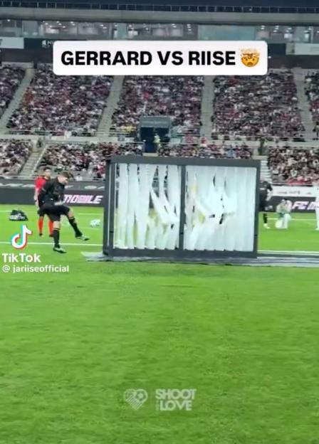 Soccer player breaking a shooting power challenge prop.