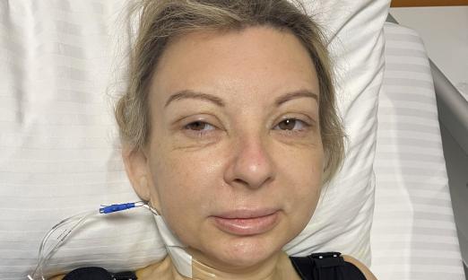 Woman in hospital bed after surgery.
