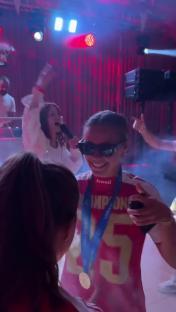 Chloe Kelly dancing with a medal at an Arsenal celebration.
