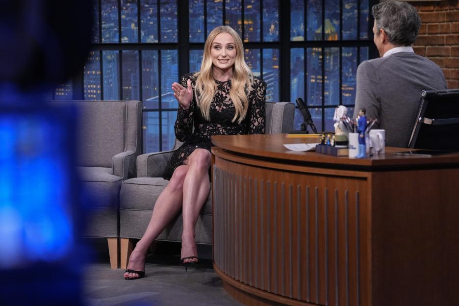 Sophie Turner being interviewed on Late Night with Seth Meyers.
